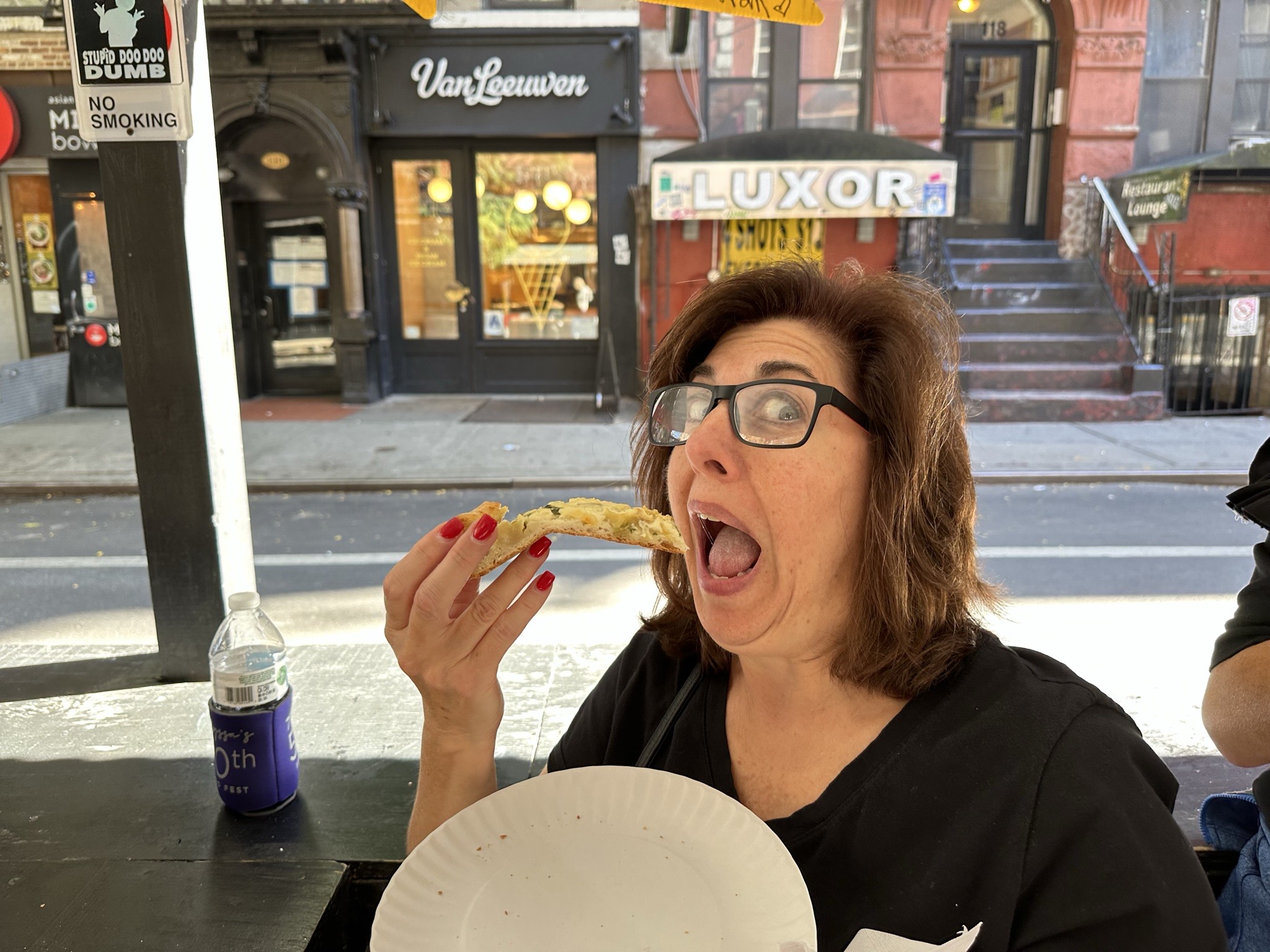 a man and a woman eating a donut