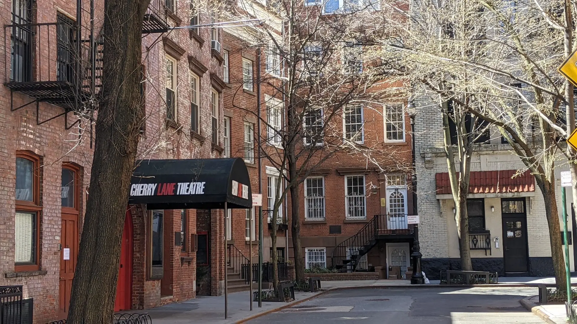 Cherry Lane Theatre entrance with its red doors and black awning on Commerce Street in Greenwich Village